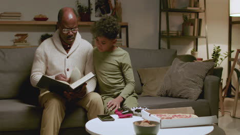 Old-black-man-and-boy-reading-a-book