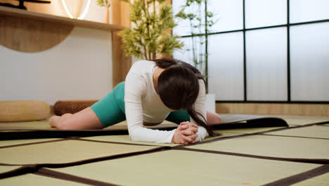 Woman-doing-yoga-indoors