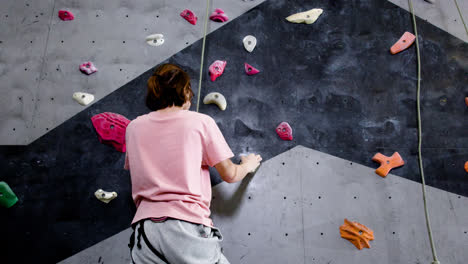 Teenage-boy-climbing-indoors