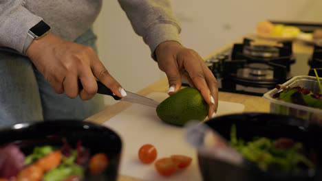Woman-cutting-an-avocado