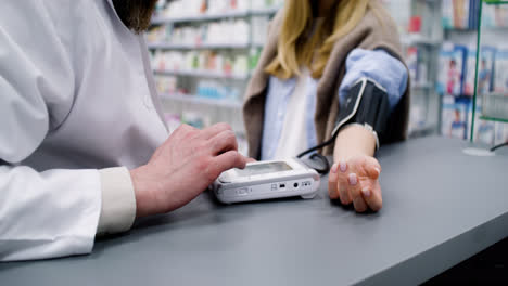 Pharmacist-checking-blood-pressure