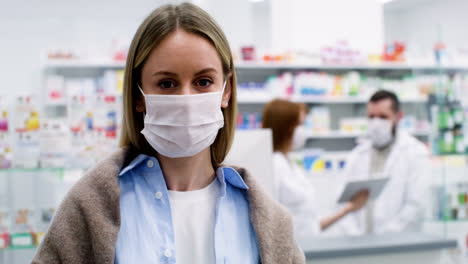 Woman-with-medical-mask-at-the-pharmacy