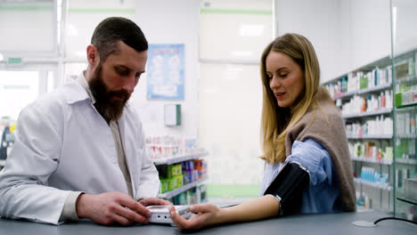 Pharmacist-checking-blood-pressure