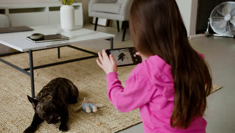 Girl-taking-pictures-of-dog