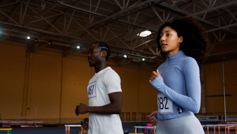 Man-and-woman-running-indoors