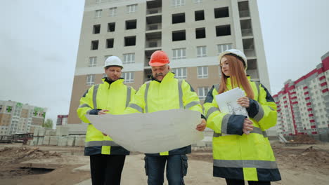 engineering-team-are-inspecting-building-site-foreman-is-viewing-constructing-plan-on-paper