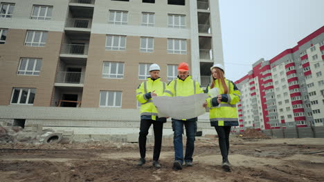 building-inspection-of-new-construction-object-two-male-foreman-and-female-architect-in-building-site