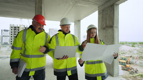 building-inspection-on-construction-site-young-female-architect-and-foremen-real-estate-due-diligence