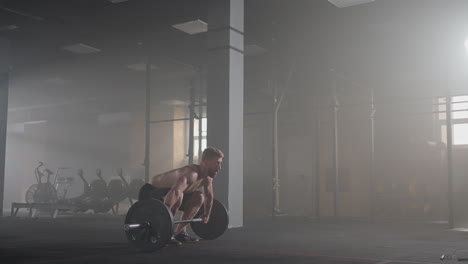 Slow-motion:-man-doing-deadlift-exercise-at-gym