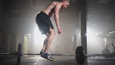 Man-doing-burpee-workout-at-fitness-studio.-High-intensity-interval-training.-Young-man-practicing-burpee-exercise