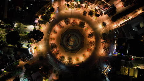 Aerial-hyperlapse-rotating-above-the-night-lit-Cibeles-fountain,-in-Mexico-city