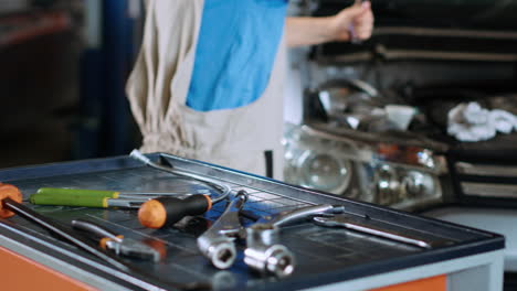 Mechanic-in-car-service-changing-oil