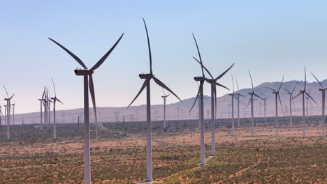 Wind-turbine-farm-in-California's-Mojave-Desert,-aerial-static-shot