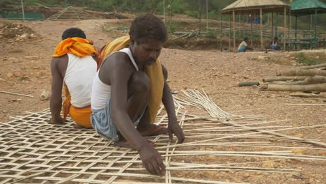 South-Asian-carpenters-weaving-the-bamboo-roof,-Bamboo-weaving,-Wide-Angle-shot
