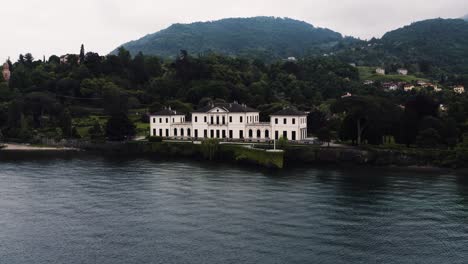 Drone-shot-pulling-away-from-a-private-well-maintained-estate-on-Lake-Como-in-Italy