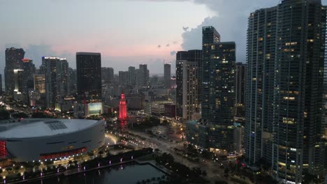 Aerial-zoom-out-of-Miami-downtown-with-freedom-tower-illuminated-at-night