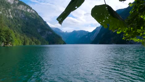 Dolly-shot-moving-forward-of-Europe-cleanest-lake,-King's-Lake,-Königssee-in-Germany,-Bavaria