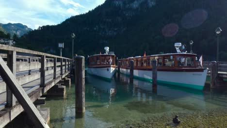 Electric-powered-passenger-boat-arriving-to-the-dock-in-King's-Lake,-Königssee,-Germany,-Bavaria