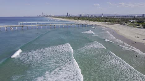 Waves-Coming-To-The-Sandy-Strip-Of-The-Spit-Gold-Coast---Fishing-Pier-And-Seawall