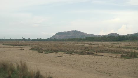 Sacred-Falgu-River-dry-waterbed-with-a-long-stretch-of-sand-dunes,-Bodhgaya,-Bihar,-India