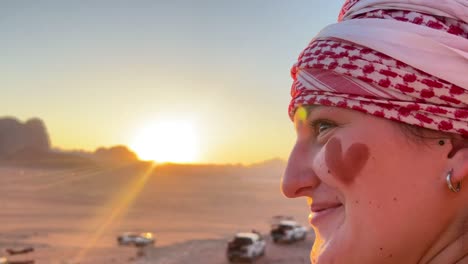 Beautiful-women-with-bedouin-makeup-at-sunset-in-the-red-desert-of-Wadi-Rum,-Jordan