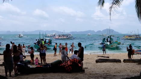 Tourist-on-the-popular-and-busy-Seven-Commandos-beach-during-island-hopping-tour-from-El-Nido-in-Palawan,-Philippines,-Southeast-Asia