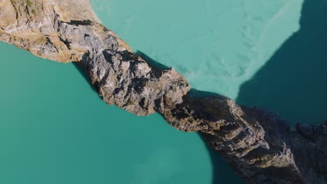 A-Close-Aerial-View-Shot-Of-Blue-Volcanic-Crater-Lakes-On-A-Volcanic-Mountain