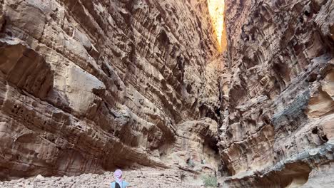Women-in-Wadi-Rum-canyon-moving-away-in-Jordan