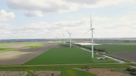 Wind-turbines-forward-movement-aerial-dutch-landscape