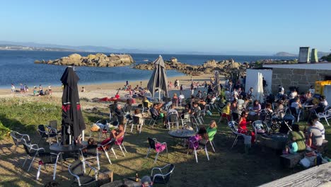 Outdoor-terrace-of-a-Spanish-seaside-bar-at-a-sunny-day-in-O-Grove,-Galicia