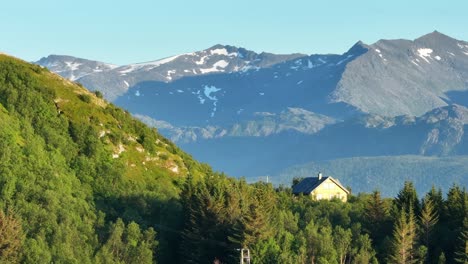 Forest-Home-And-Mountain-Scenery-In-Bovaer,-Senja-Island,-Norway