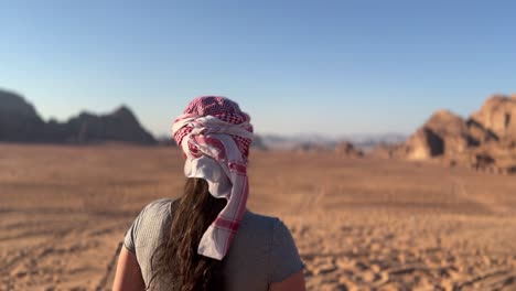 Beautiful-women-with-bedouin-makeup-in-the-red-desert-of-Wadi-Rum,-Jordan