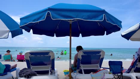Beach-Umbrella-chair-on-the-Beach-with-turquoise-water