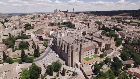 Aerial-arc-shot-of-Monastery-of-San-Juan-de-los-Reyes,-Toledo,-Spain