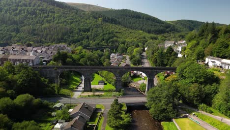 An-aerial-drone-shot-of-a-beautiful-valley-in-South-Wales-with-an-old-viaduct