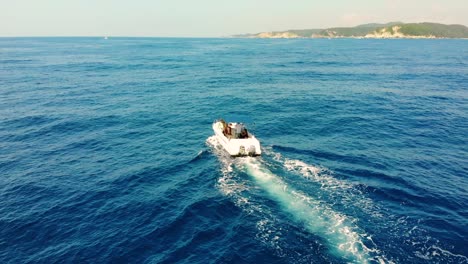 open-sea-yacht-speedboat-cruising,-Huatulco,-Mexico-shoreline,-slowmotion-aerial