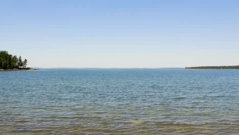 View-of-clear-sky-and-blue-water-of-the-Atlantic-Ocean-from-a-typical-Northern-New-England-beach-during-mid-summer,-late-afternoon