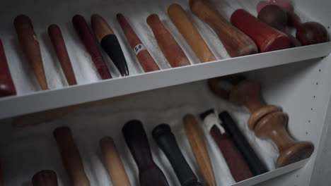 Wooden-massage-tools-on-a-shelf
