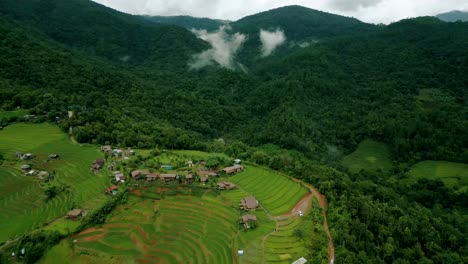 4K-Cinematic-nature-aerial-drone-footage-of-the-beautiful-mountains-and-rice-terraces-of-Ban-Pa-Pong-Piang-at-Doi-Ithanon-next-to-Chiang-Mai,-Thailand-on-a-cloudy-sunny-day