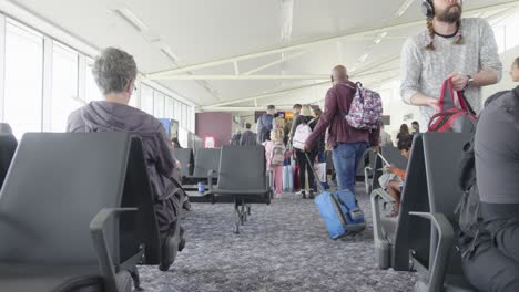 Departure-lounge-of-airport-as-passengers-make-their-way-to-board-a-plane