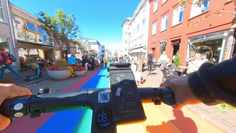through-the-city-of-reykjavík-on-an-electric-scooter-along-rainbow-street