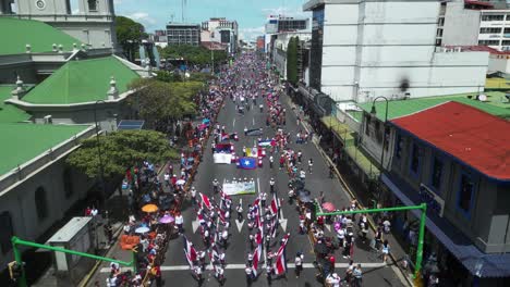 Drone-Shot-Over-Flag-Bearers-and-Marching-Bands-During-Costa-Rican-Independence-Day-Parade