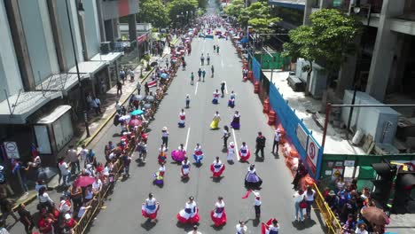 Drone-Flying-Over-School-Children-in-Traditional-Dresses-During-Costa-Rica-Independence-Day-Parade