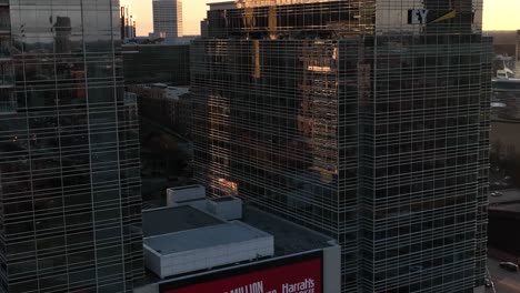 Casino-Resort-digital-advertisement-on-Downtown-Atlanta-Peachtree-Street-Billboard,-Sunlight-falling-on-glass-buildings