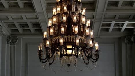 Vintage-Crystal-Chandelier-Over-The-Ceiling-Of-An-Old-Ministry-Of-Treasure-Building-In-Rio-de-Janeiro,-Brazil