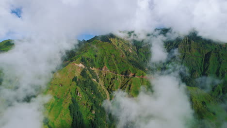 Cloud-covers-Green-landscapes,-hills-and-trekking-trails-Nepal-for-tourism,-blue-sky-greenery-grounds-and-nature-clean