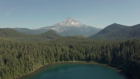 High-aerial-shot-over-a-lake-towards-Mount-Hood