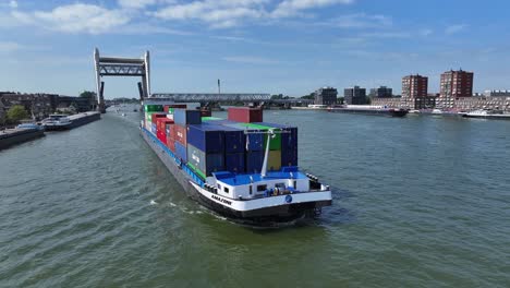 The-container-vessel-the-Amazone-sailing-up-the-Oude-Maas-river,-aerial