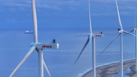 Row-of-Wind-turbines-rotating-propellers-generating-energy-for-consumers