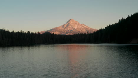 Dolly-back-establishing-aerial-shot-of-Mount-Hood-from-Lost-Lake-at-sunset